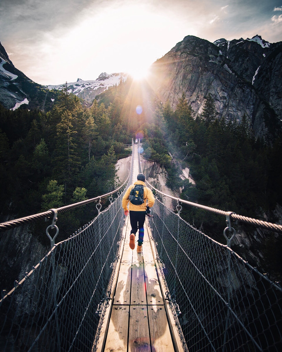 Photo by Fabio Comparelli running man on bridge